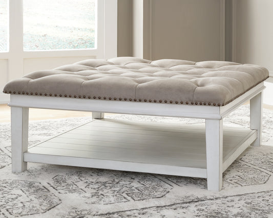 Haines Furniture Outlet - Ashley Furniture - Kanwyn Upholstered Ottoman Coffee Table - UPH Ottoman Cocktail Table / Whitewash - T937-21