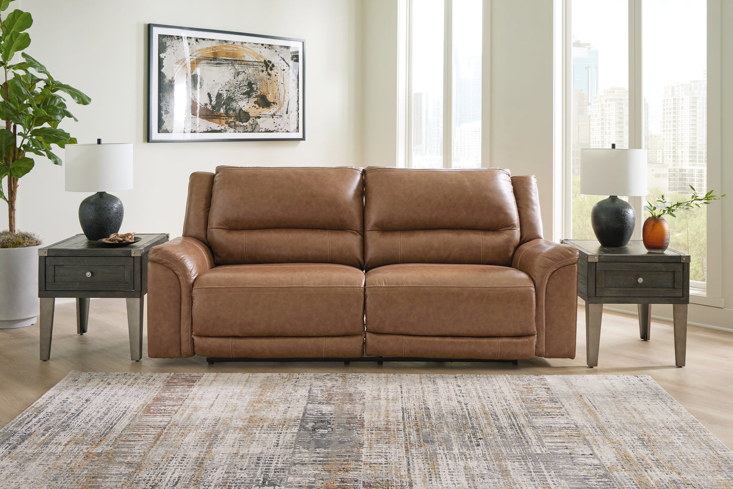 Haines Furniture Outlet - Ashley Furniture - Trasimeno Living Room - PWR Recliner/ADJ Headrest / Caramel - U8281513