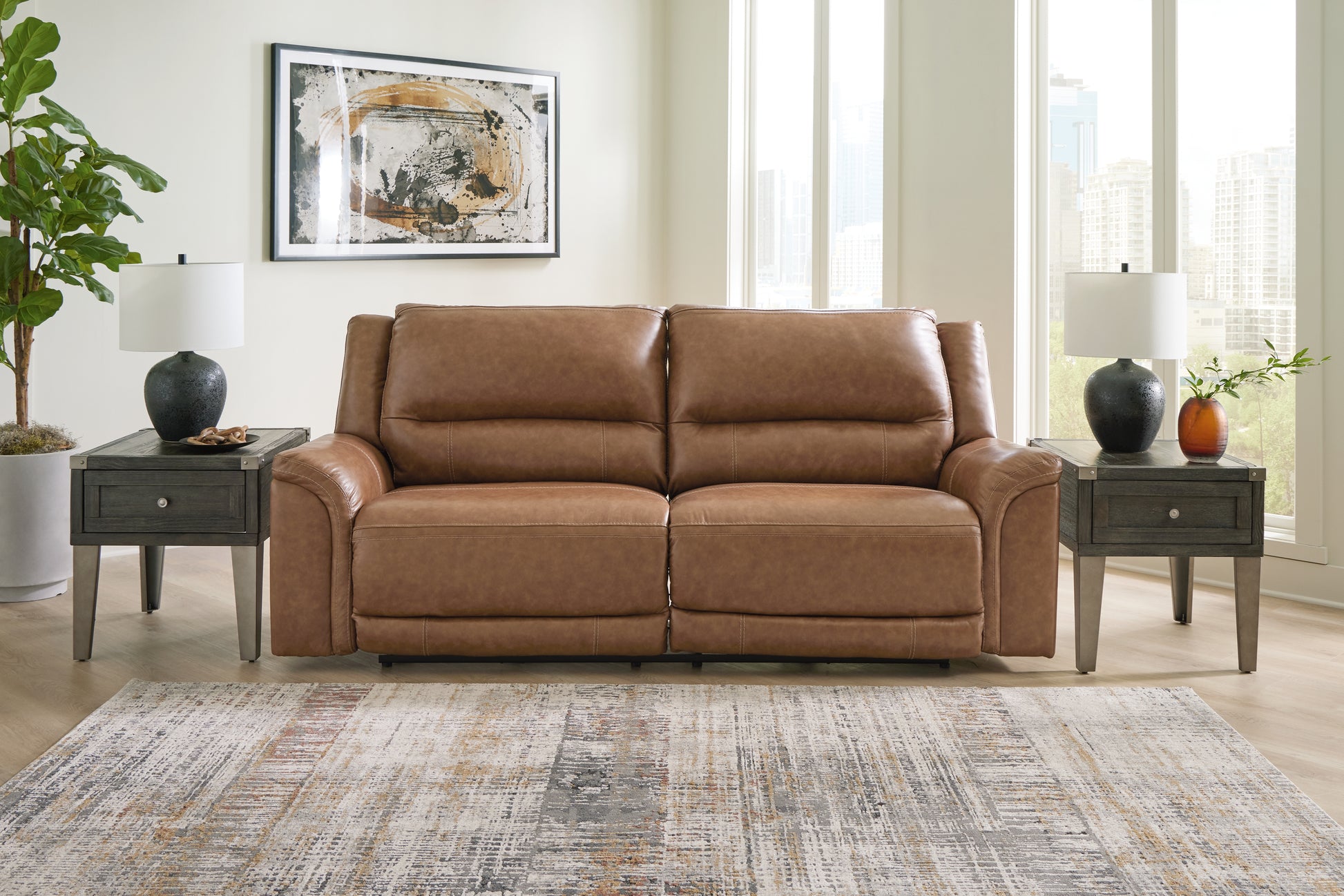 Haines Furniture Outlet - Ashley Furniture - Trasimeno Living Room - PWR Recliner/ADJ Headrest / Caramel - U8281513