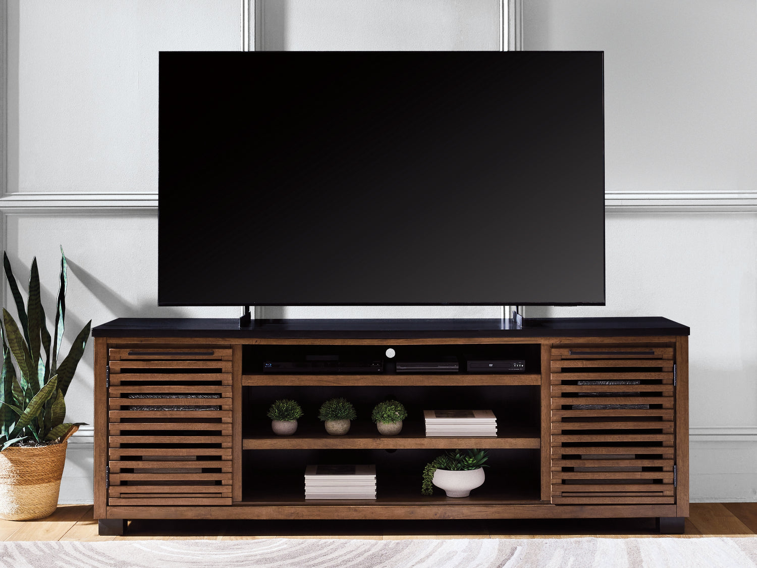 Haines Furniture Outlet - Ashley Furniture - Kallari 84" TV Stand - 84" / Warm Brown/Black - W737-78