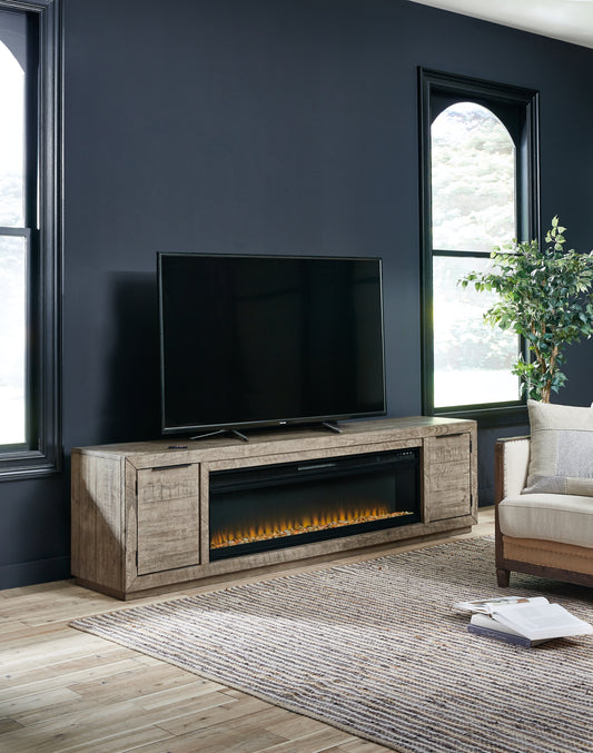 Haines Furniture Outlet - Ashley Furniture - Krystanza TV Stand with Electric Fireplace - TV Stand with Electric Fireplace / Weathered Gray - W760W1