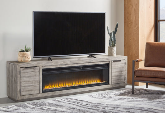 Haines Furniture Outlet - Ashley Furniture - Naydell 92" TV Stand with Electric Fireplace - 92" TV Stand with Electric Fireplace / Gray - W996W1